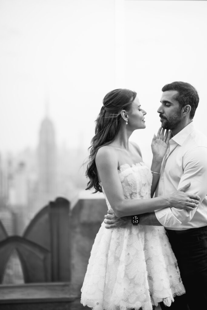 Olya and Felipe share a tender smile, their love illuminated by the dreamy sunset light behind them.